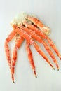 frosted Alaska king crab legs closeup photo on white table background Royalty Free Stock Photo