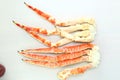 frosted Alaska king crab legs closeup photo on white table background Royalty Free Stock Photo