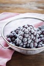 Frosted cherry berries in sieve