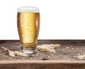 Frosted glass of beer on the wooden table. Royalty Free Stock Photo