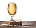 Frosted glass of beer on the wooden table. Royalty Free Stock Photo