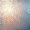 Frosted glass surface featuring an irregular texture pattern. The glass has a subtle Royalty Free Stock Photo