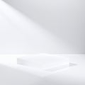 Frosted glass trapezoid podium with soft light casting shadows on white background image Royalty Free Stock Photo