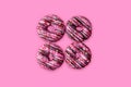 Frosted pink donuts with heart shaped sprinkles Royalty Free Stock Photo