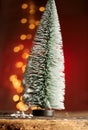 Frosted toy Christmas tree with party lights