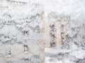 Frosted window glass and view of houses in city