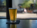 Frosty beer in a bar looking outdoors