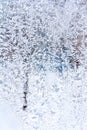 Frosty blue pattern on a winter window. Background, texture Royalty Free Stock Photo