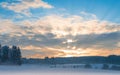 Frosty early morning winter panoramic scenery with rising sun