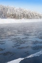 Frosty fog over winter river with snow and forest on bank Royalty Free Stock Photo