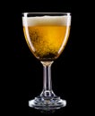 Frosty glass of light beer with foam  on a black background Royalty Free Stock Photo