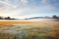 frosty meadow beneath billowy clouds