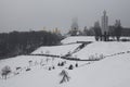 Frosty morning in the park. National Museum `Memorial to Holodomor victims` and top of Great Lavra Bell Tower is disappearing in t