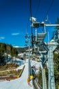 Frosty morning at the ski resort Bukovel. Ski slope and wooden cottages