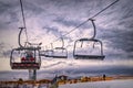 Frosty morning at the ski resort Bukovel. Ski slope and wooden cottages