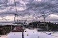 Frosty morning at the ski resort Bukovel. Ski slope and wooden cottages