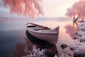 Frosty morning by a tranquil lake, boat covered in snow, pink-hued trees reflecting. Royalty Free Stock Photo