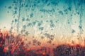 Frosty pattern on glass at sunset or sunrise Royalty Free Stock Photo