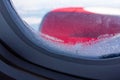 Frosty pattern on the glass window of the aircraft