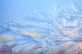 Frosty Pattern on the window in winter. Winter background. Aggregate state of water. Patterned background Royalty Free Stock Photo