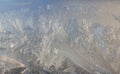 Frosty Pattern on the window in winter. Winter background. Aggregate state of water. Patterned background Royalty Free Stock Photo