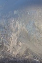 Frosty Pattern on the window in winter. Winter background. Aggregate state of water. Patterned background Royalty Free Stock Photo