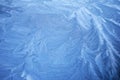Frosty Patterns. Close-up of intricate frost designs on a blue surface, Royalty Free Stock Photo