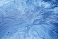 Frosty Patterns. Close-up of intricate frost designs on a blue surface, Royalty Free Stock Photo