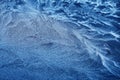 Frosty Patterns. Close-up of intricate frost designs on a blue surface, Royalty Free Stock Photo