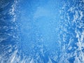 Frosty patterns on a frozen window. Royalty Free Stock Photo