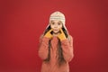 Frosty weather. Winter outfit. Cute model enjoy winter style. Little kid wear knitted hat. Little girl winter fashion Royalty Free Stock Photo