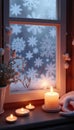 Cozy winter scene with candlelight shining through a frosty window and snowflakes on display Royalty Free Stock Photo