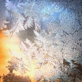 Frosty Window Glass with Natural Ice Patterns and Blurred Colorful Background. Winter Holidays Season, Fantasy World Concept Royalty Free Stock Photo