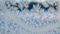Frosty window with intricate ice crystals Royalty Free Stock Photo