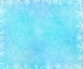 Frosty winter background with glowing snowflakes frame. Royalty Free Stock Photo