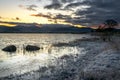 A frosty winter sunrise and fiery skies at Bassenthwaite Lake in the Lake District National Park, Cumbria, England Royalty Free Stock Photo