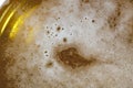 Froth on a blond beer macro still Royalty Free Stock Photo