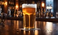 Frothy beer being poured into a chilled glass