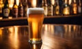 Frothy beer being poured into a chilled glass