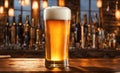 Frothy beer being poured into a chilled glass