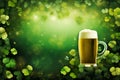 Frothy beer, lucky four-leaf clover, green background for St. Patricks Day Royalty Free Stock Photo