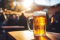 Frothy beer mug on a table with a bokeh background of people.