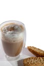Frothy cappuccino coffee with almond biscotti biscuits on white Royalty Free Stock Photo