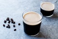 Frothy Cold Brew Nitro Coffee with Beans Ready to Drink Royalty Free Stock Photo