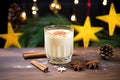 frothy eggnog in a decorated glass, sugar rim, star anise atop