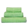 3 frotte towels green color, bedroom towel white backgroung. Colorful green bath towels isolated on white. Stack green towels. Royalty Free Stock Photo