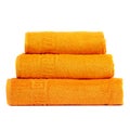 3 frotte towels orange color, bedroom towel white backgroung. Colorful orange bath towels isolated on white. Stack orange towels. Royalty Free Stock Photo