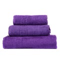 3 frotte towels purple color, bedroom towel white backgroung. Colorful violet bath towels isolated on white. Stack violettowels. Royalty Free Stock Photo