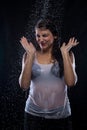 Frowned young brunette under running water Royalty Free Stock Photo