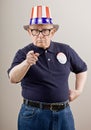 Frowning patriotic man in American flag hat Royalty Free Stock Photo